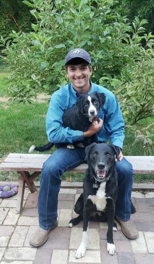 dr barnes sitting with two dogs